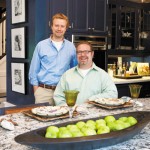 Partners John Larson and Mike Stewart in their kitchen designed by Bonnie Birnhaum and Karen Soojian. Photo by Hubert Bonnet.