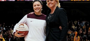 Sophomore Guard Rachel Banham was awarded the game ball for scoring her career 1000th point in the Minnesota vs Illinois game on 01.28.12

Pictured l-r
Rachel Banham
Coach Pam Borton